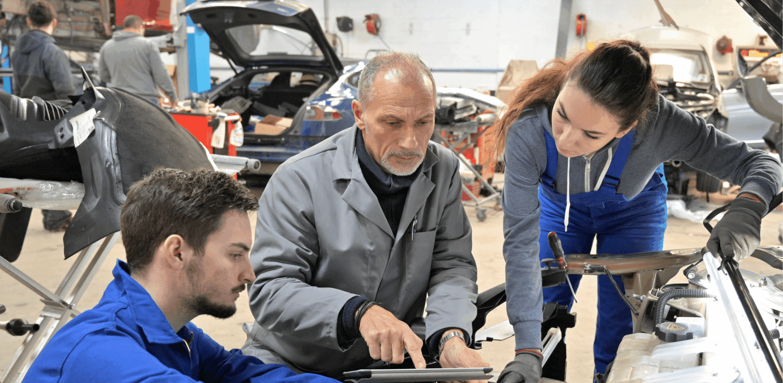 group of students learning about mechanics in a lab
